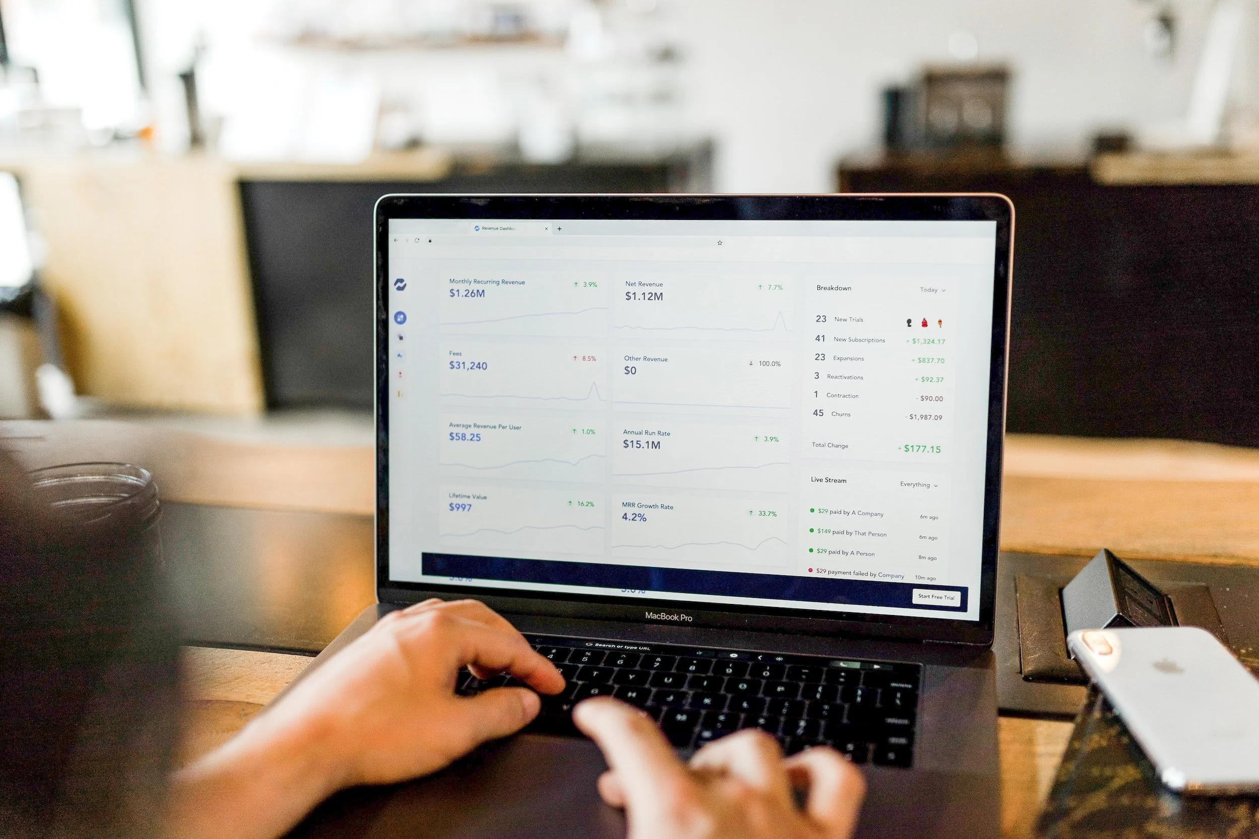 Laptop displaying a revenue dashboard